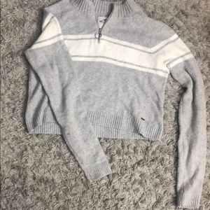 Cropped grey and white sweater with a quarter zip